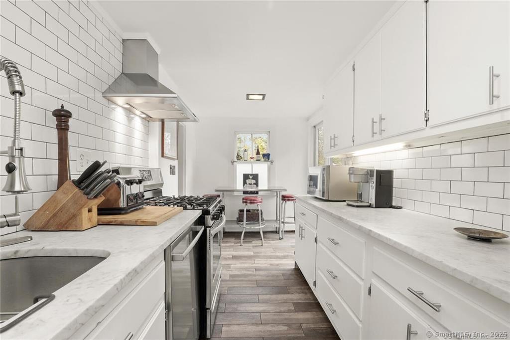 47 Hollow Tree Ridge Road, Unit A Darien, CT 06820 - Photo 13 of 33 Updated Kitchen with stainless appliances and