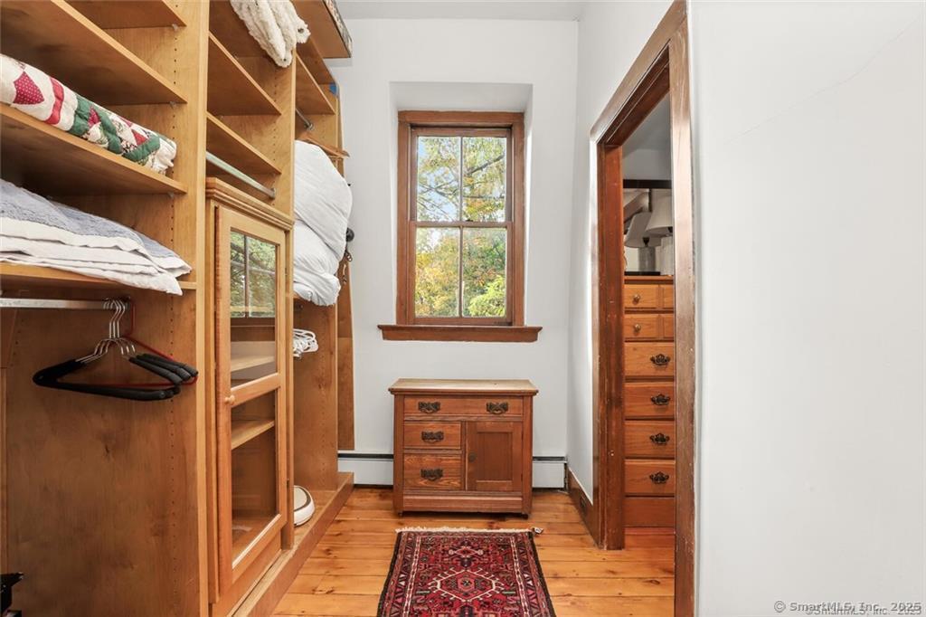 47 Hollow Tree Ridge Road, Unit A Darien, CT 06820 - Photo 20 of 33 Primary BR Walk-in-closet/dressing area