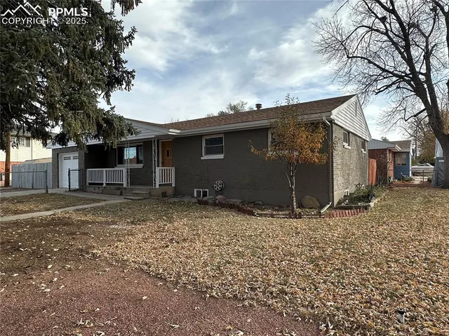 a backyard of a house with large trees