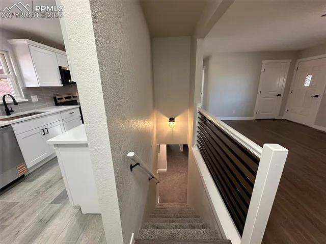 a view of a livingroom with wooden floor