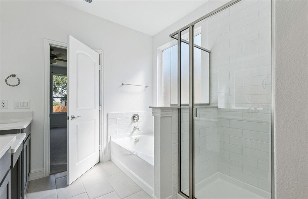 444 Avian Way Godley, TX 76044 - Photo 13 of 22 Owner's bath with tub and shower