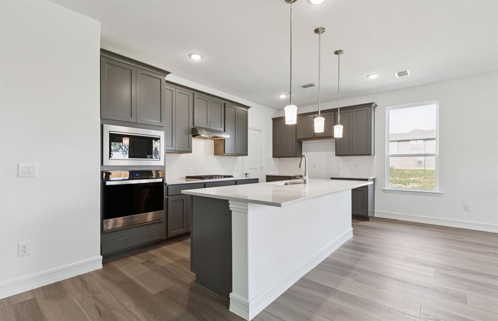 444 Avian Way Godley, TX 76044 - Photo 8 of 22 Eat-in bartop island in kitchen