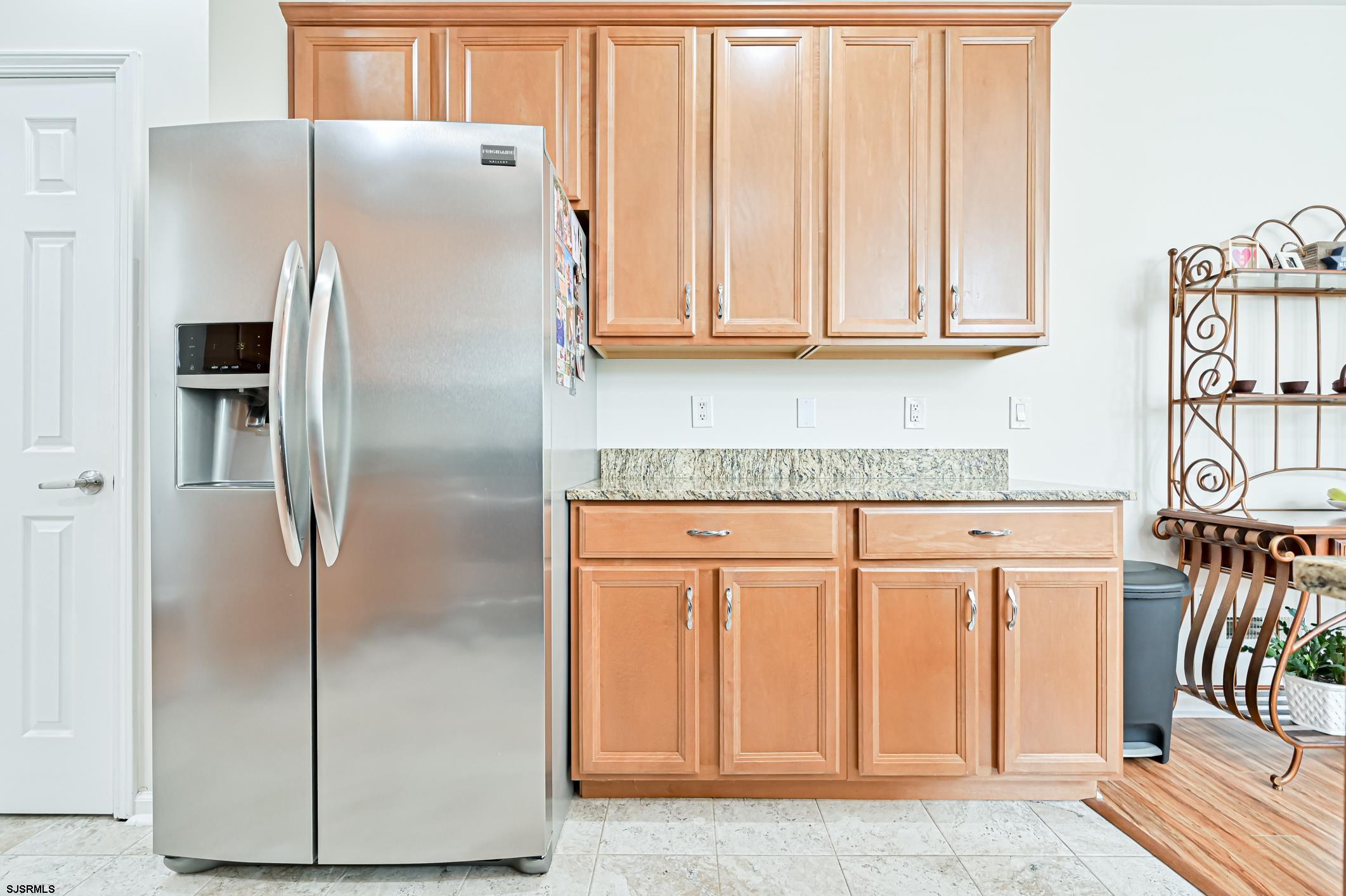 27 Ables Run Drive Absecon, NJ 08201 - Photo 11 of 28 a metallic refrigerator freezer sitting in a kitchen
