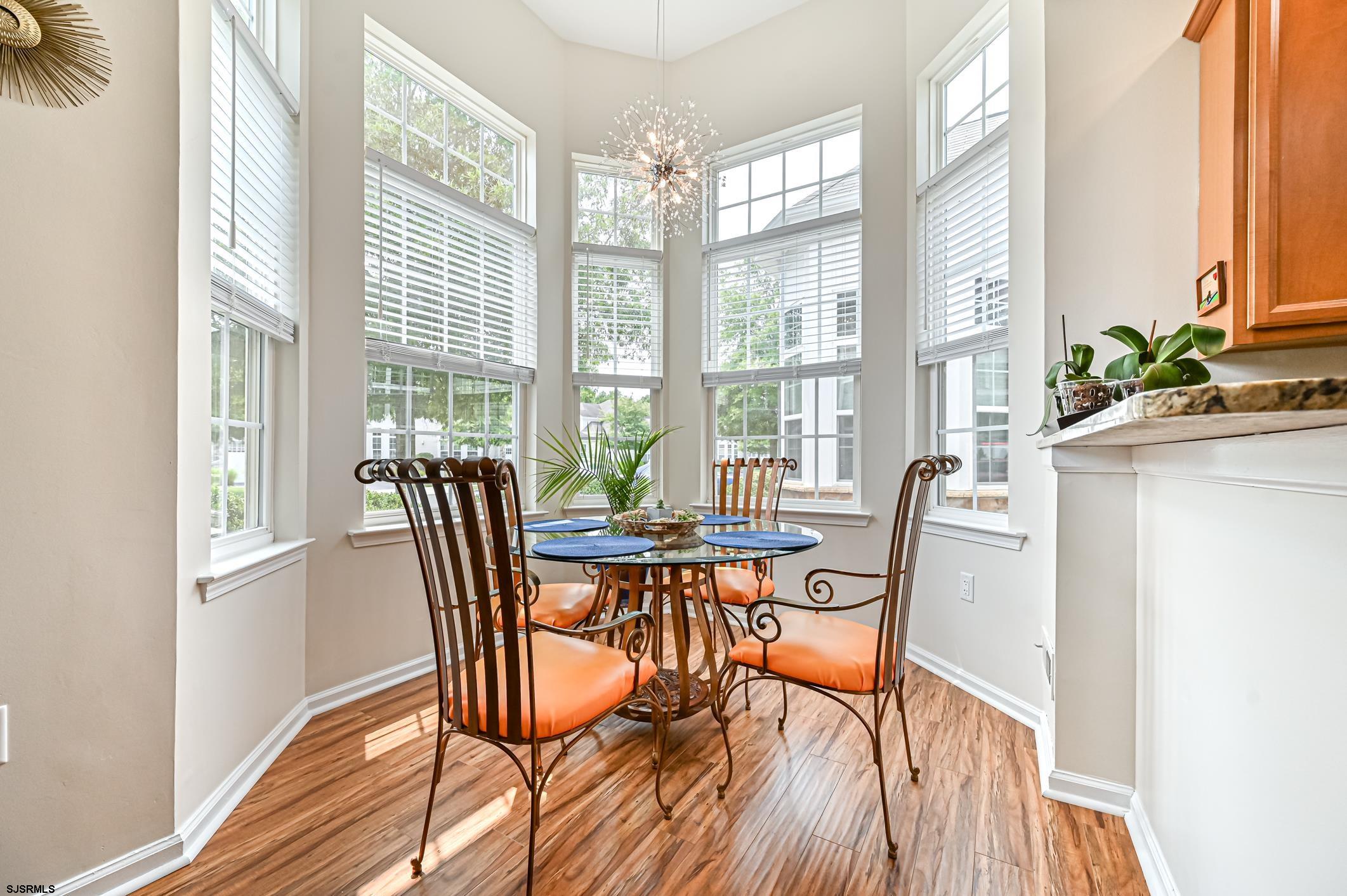 27 Ables Run Drive Absecon, NJ 08201 - Photo 12 of 28 a dining room with furniture a chandelier and wooden floor