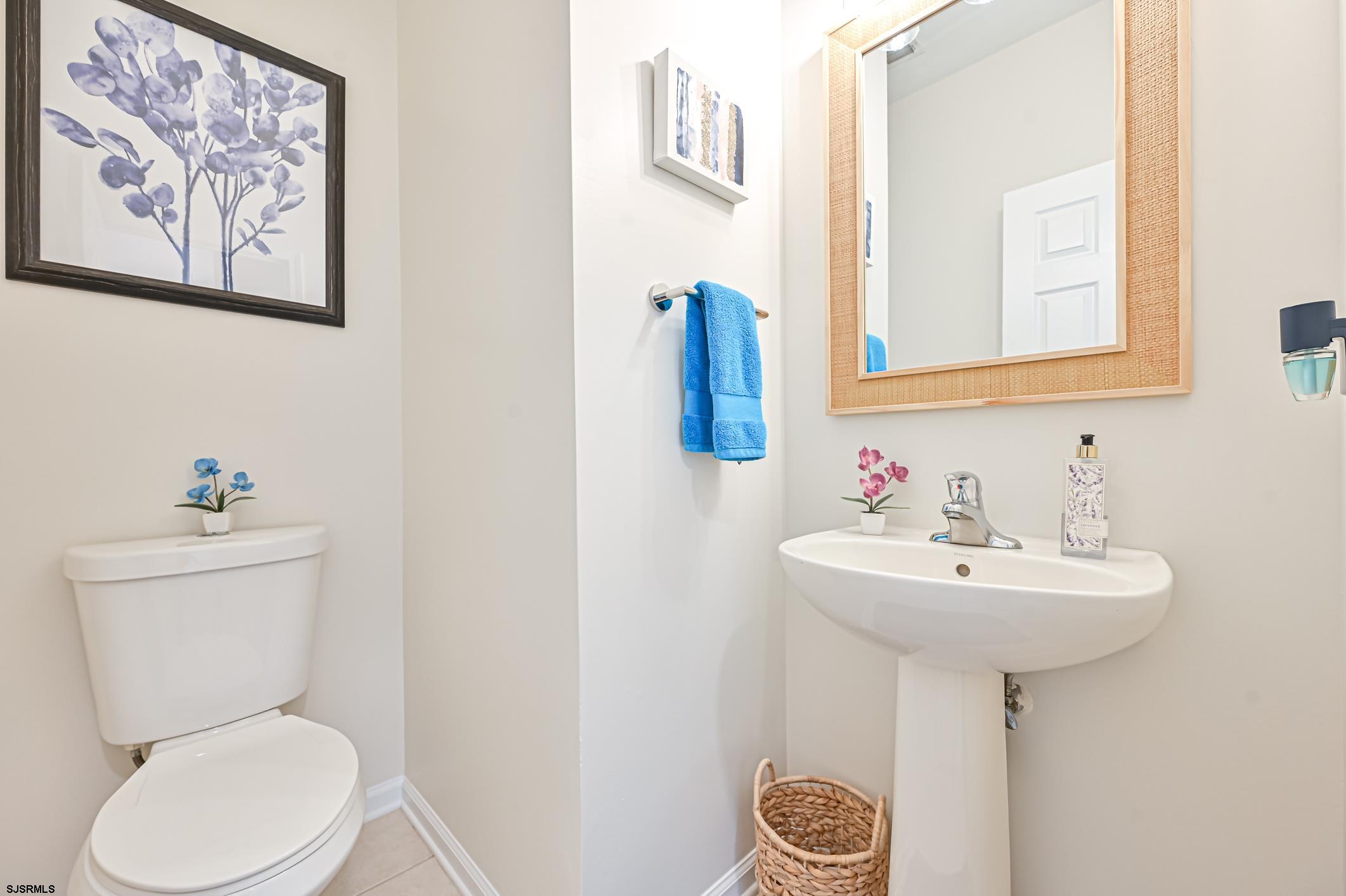 27 Ables Run Drive Absecon, NJ 08201 - Photo 13 of 28 a bathroom with a toilet sink and mirror