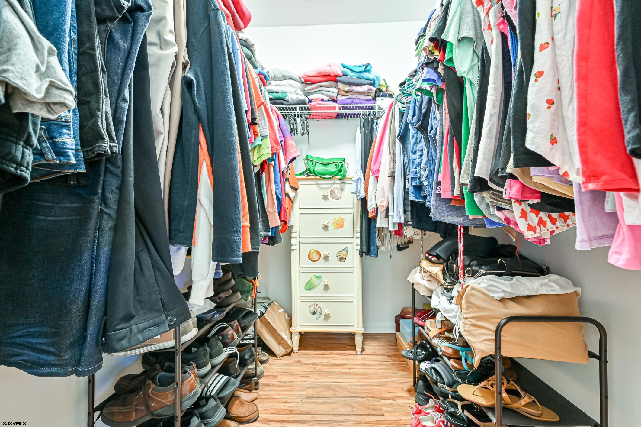 27 Ables Run Drive Absecon, NJ 08201 - Photo 16 of 28 a view of walk in closet with clothes and shoes
