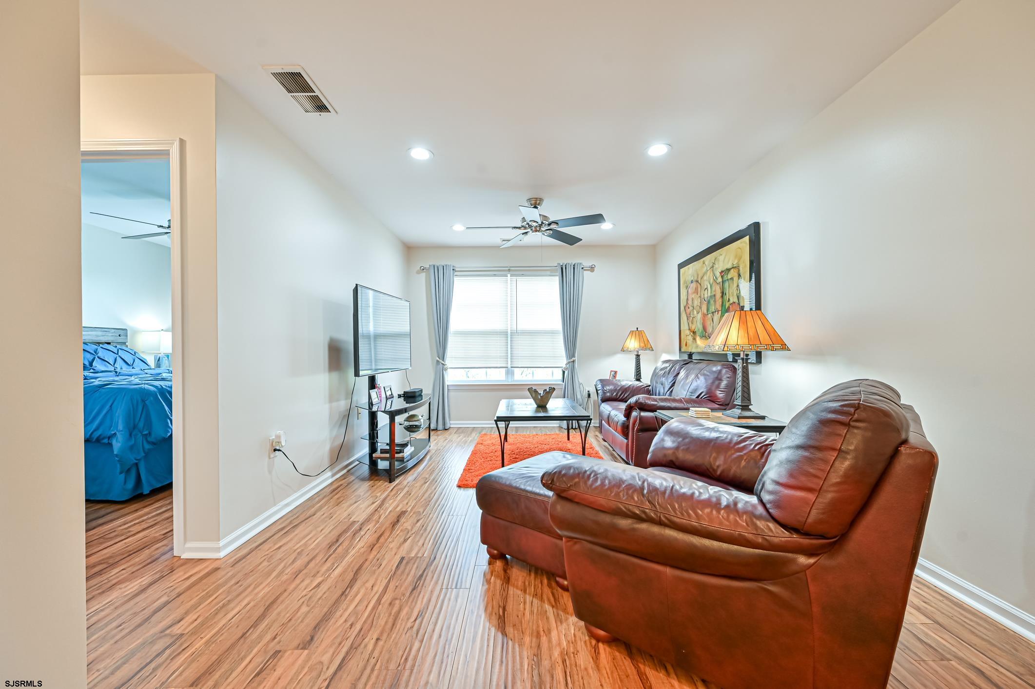 27 Ables Run Drive Absecon, NJ 08201 - Photo 19 of 28 a living room with furniture and a wooden floor