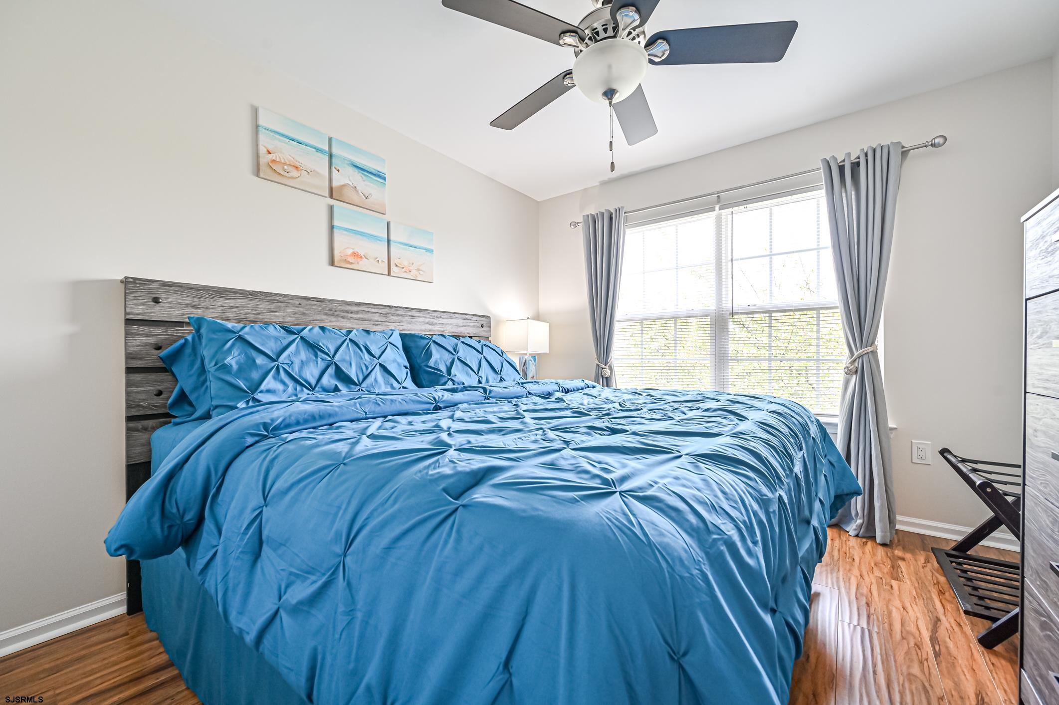 27 Ables Run Drive Absecon, NJ 08201 - Photo 22 of 28 a large bed sitting in a bedroom next to a window