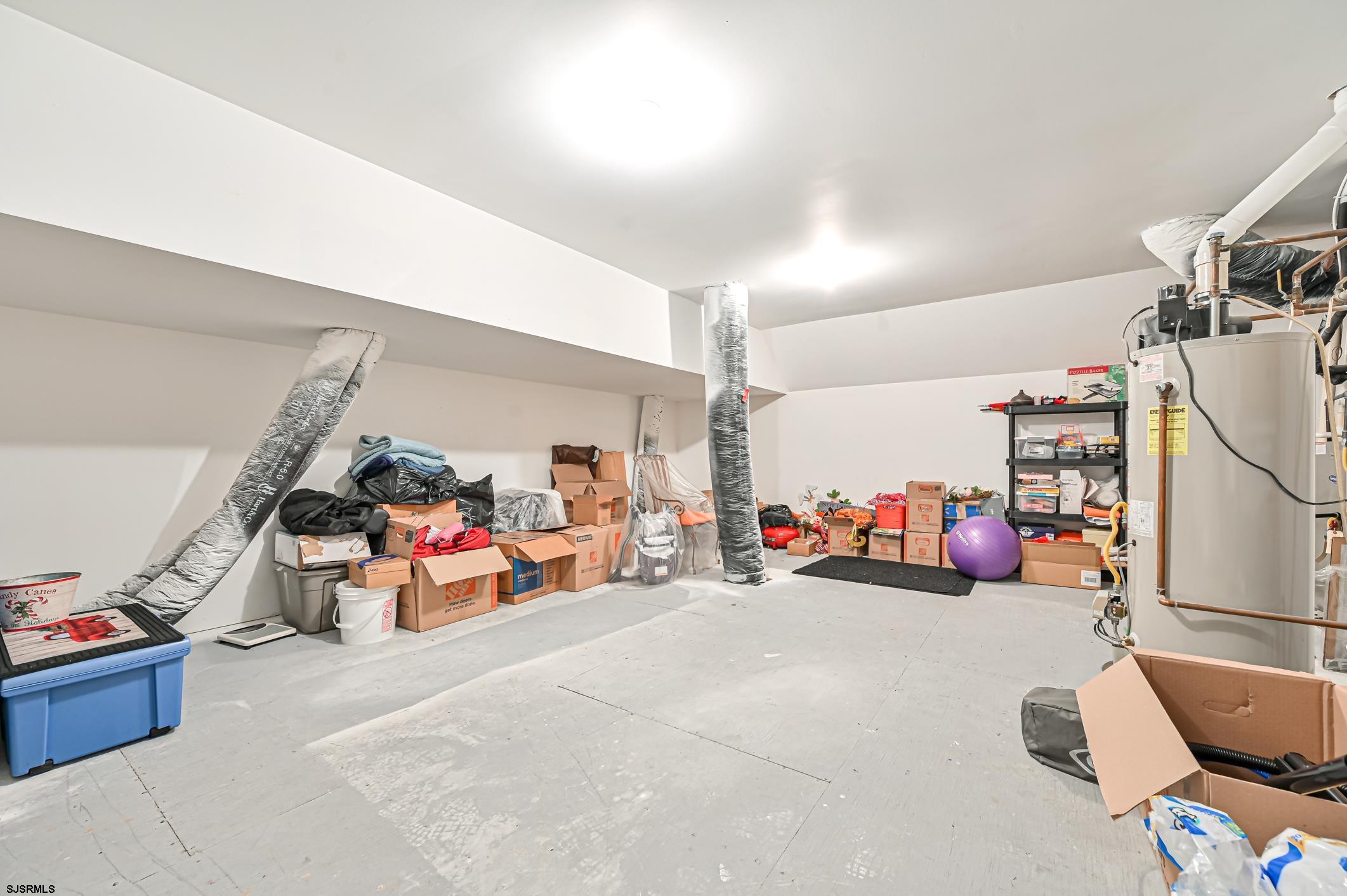 27 Ables Run Drive Absecon, NJ 08201 - Photo 23 of 28 a view of a garage with rack and bicycle