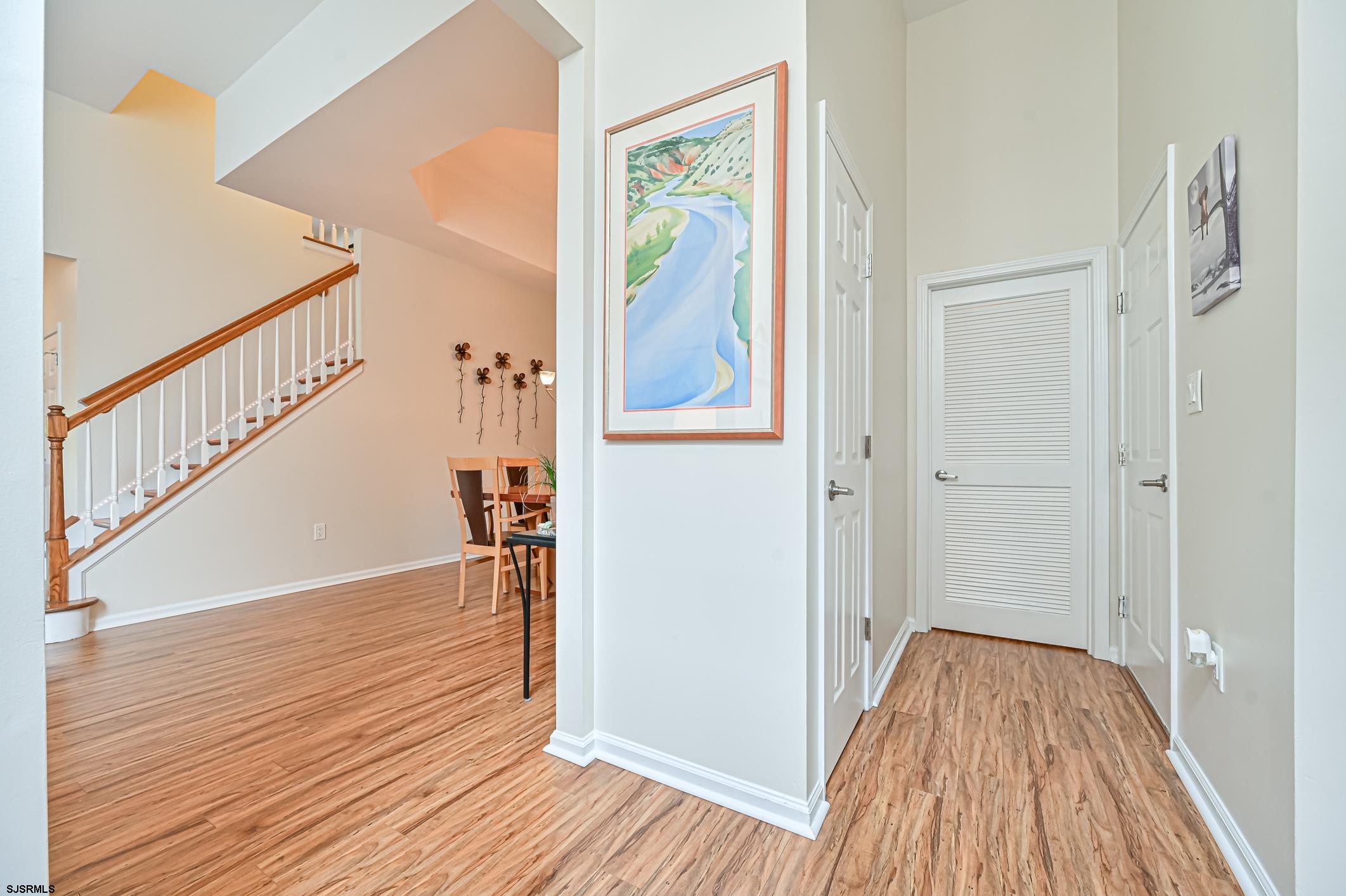27 Ables Run Drive Absecon, NJ 08201 - Photo 5 of 28 a view of hallway with wooden floor and stairs