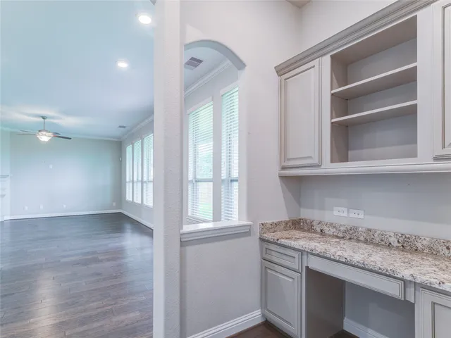 a bathroom with a tub a sink and mirror