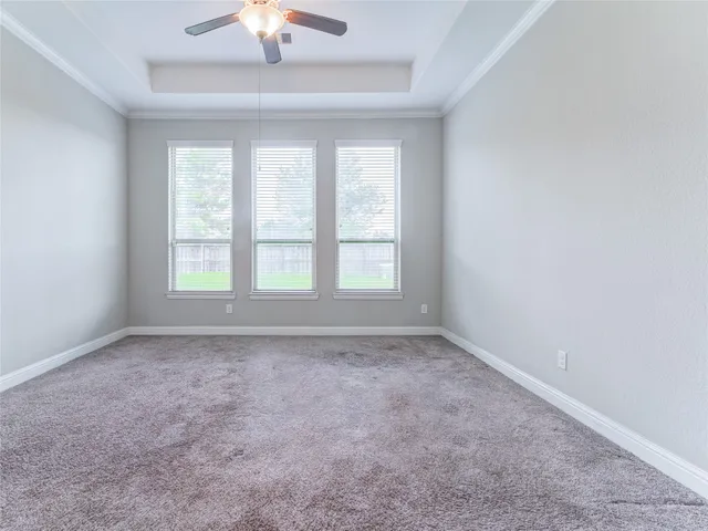 an open kitchen with sink and refrigerator
