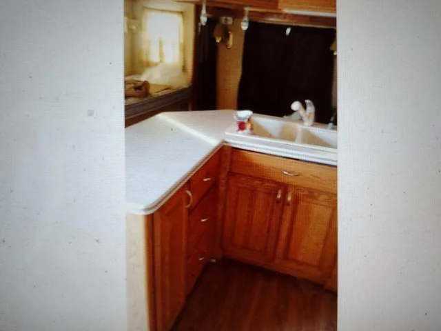 a kitchen with stainless steel appliances granite countertop a stove and a microwave