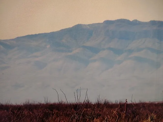 a view of a room with painting on the wall