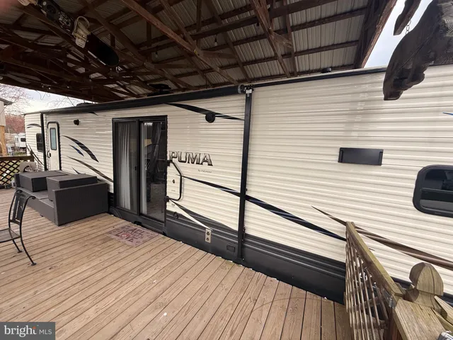 a view of a balcony with wooden floor