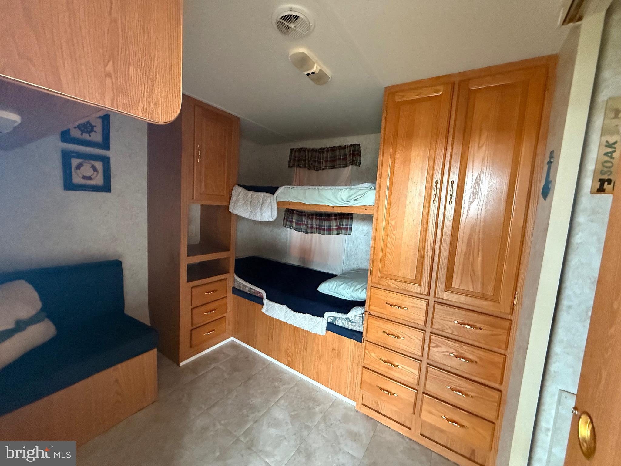 6 Block Yogi Bear Lane Falling Waters, WV 25419 - Photo 5 of 8 a kitchen with stainless steel appliances a refrigerator and cabinets