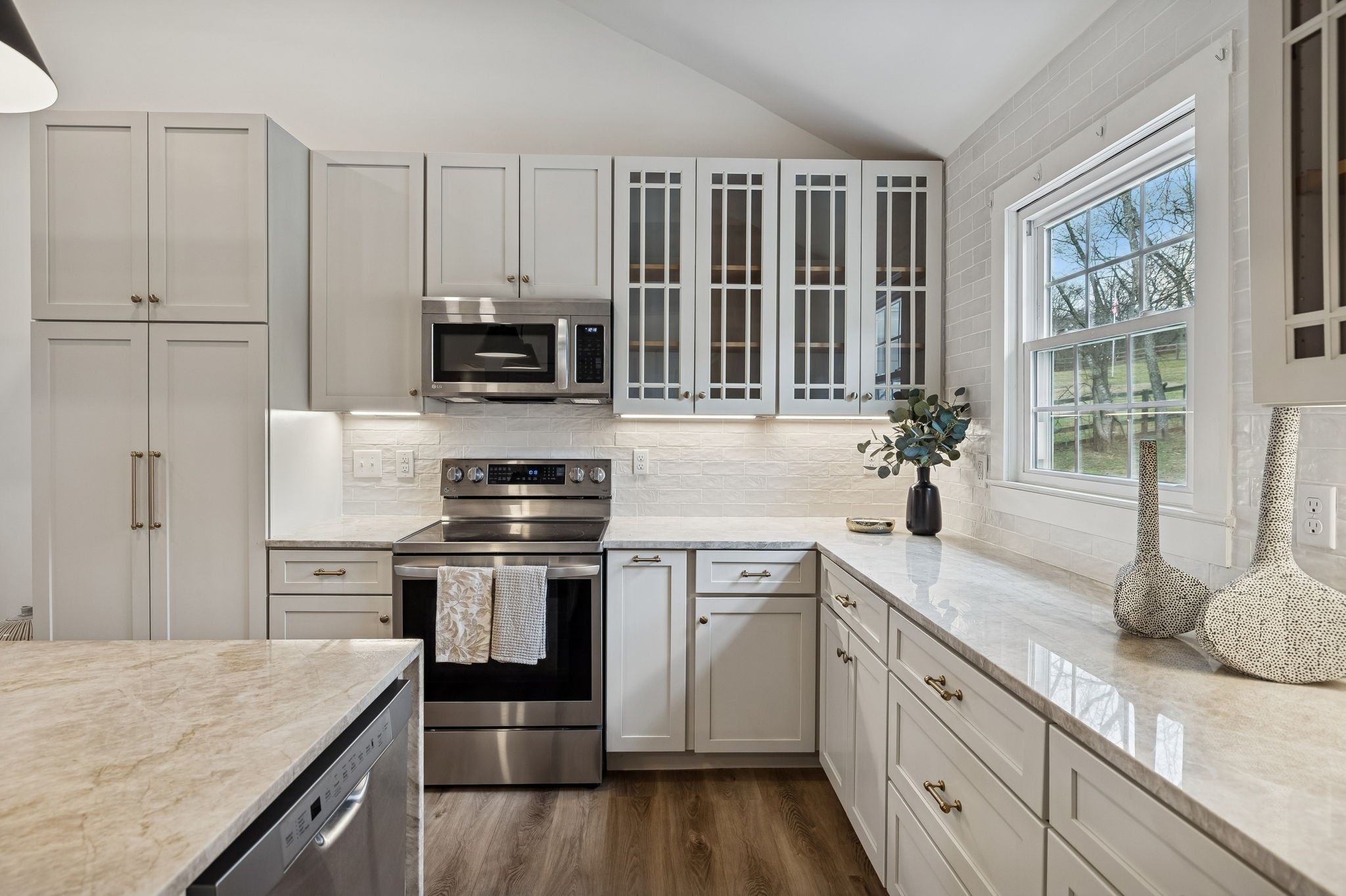 670 North Ridge Road Columbia, TN 38401 - Photo 11 of 45 a kitchen with granite countertop a stove and a sink