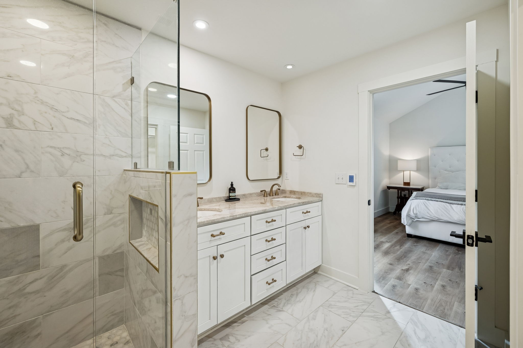 670 North Ridge Road Columbia, TN 38401 - Photo 16 of 45 a spacious bathroom with a double vanity sink a mirror and a shower