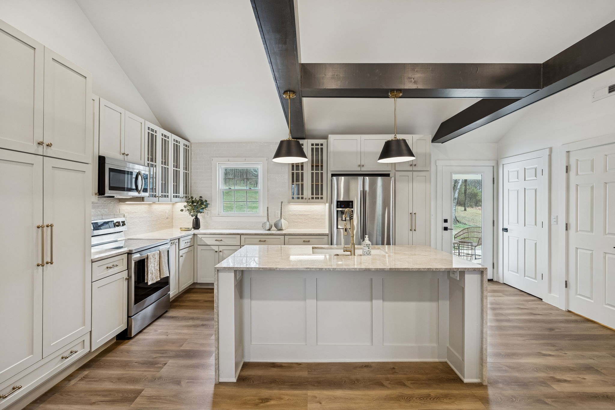 670 North Ridge Road Columbia, TN 38401 - Photo 9 of 45 a large kitchen with stainless steel appliances kitchen island granite countertop a sink and cabinets