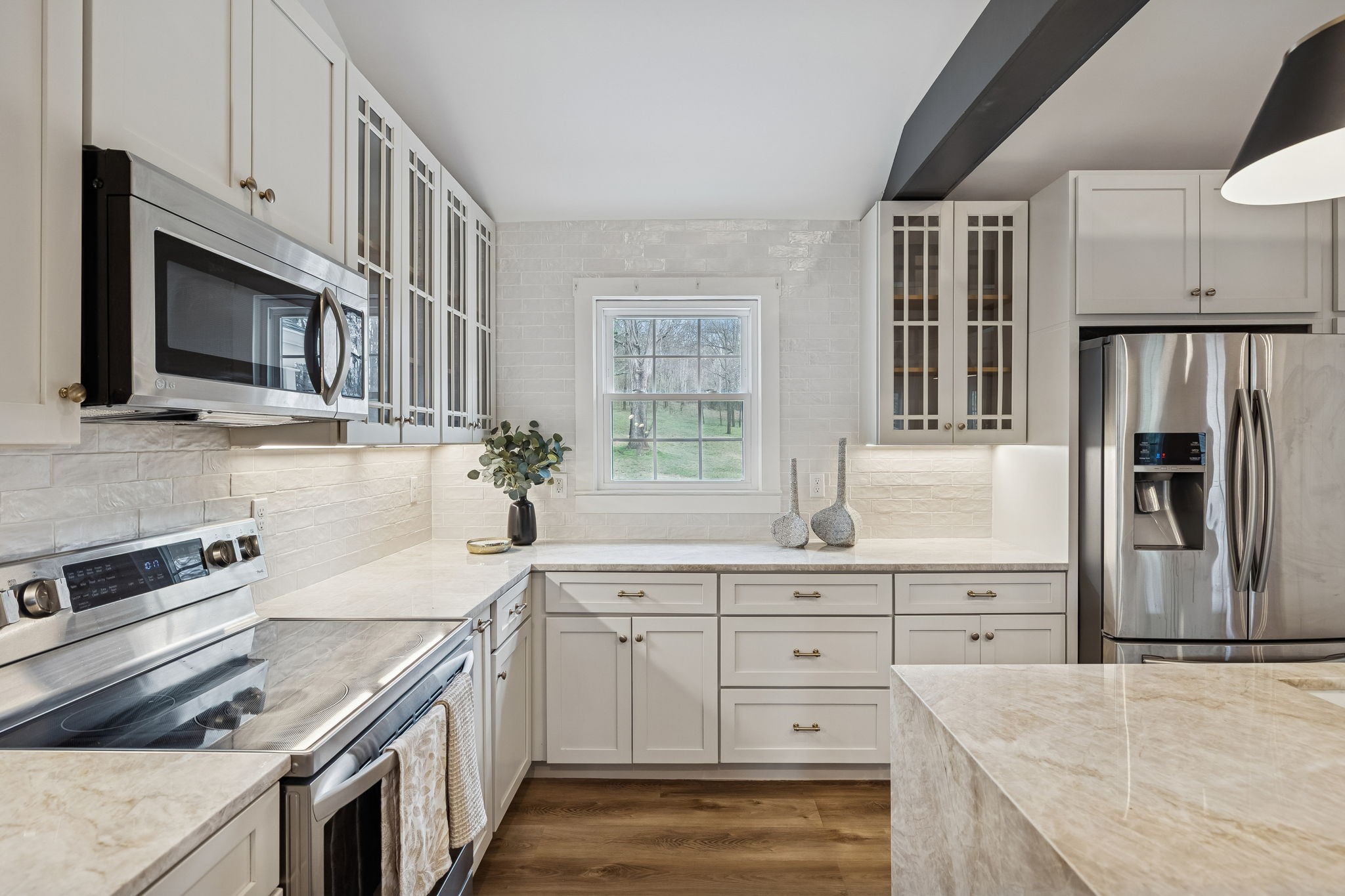 670 North Ridge Road Columbia, TN 38401 - Photo 10 of 45 a kitchen with granite countertop cabinets stainless steel appliances and a sink