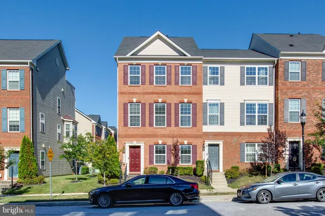 a car parked in front of a houses