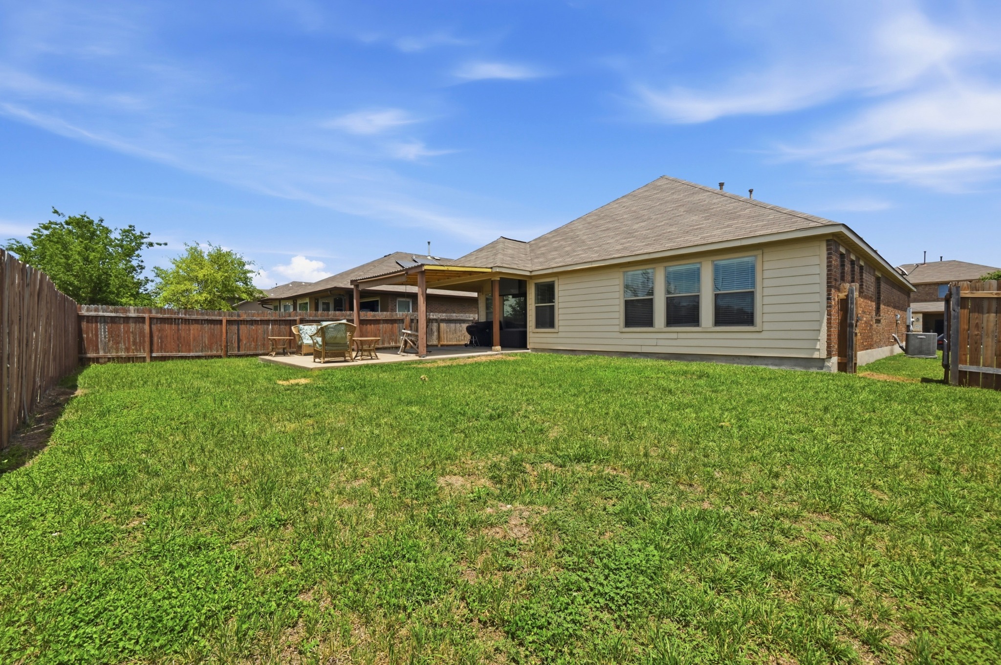 877 Hot Spring Valley Buda, TX 78610 - Photo 26 of 36 a front view of a house with a yard
