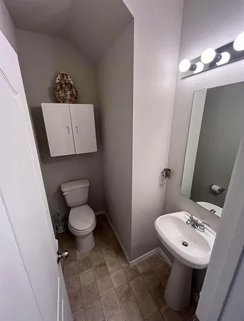 a kitchen with kitchen island stainless steel appliances a sink and a refrigerator