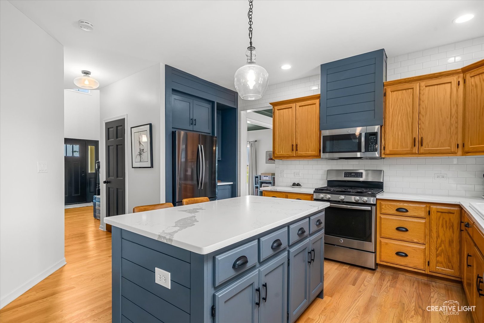 13495 Fennel Road Newark, IL 60541 - Photo 11 of 43 a kitchen with a stove a sink a refrigerator and wooden floor