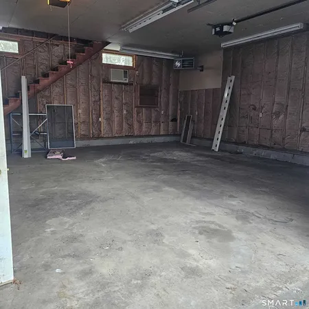 a view of a room with wooden walls
