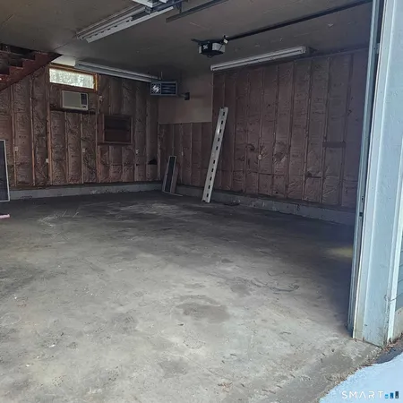 a view of a room with wooden walls