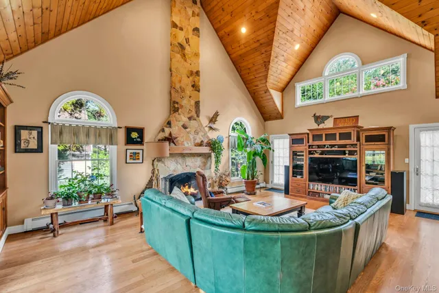a view of a house with swimming pool and a couches in a patio
