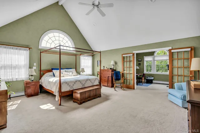 a bed room with a bed and a large window