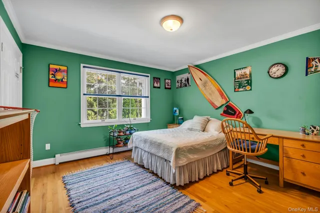 a bedroom with bed and a window