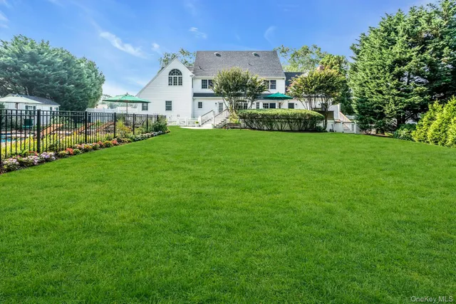 a front view of a house with garden and porch