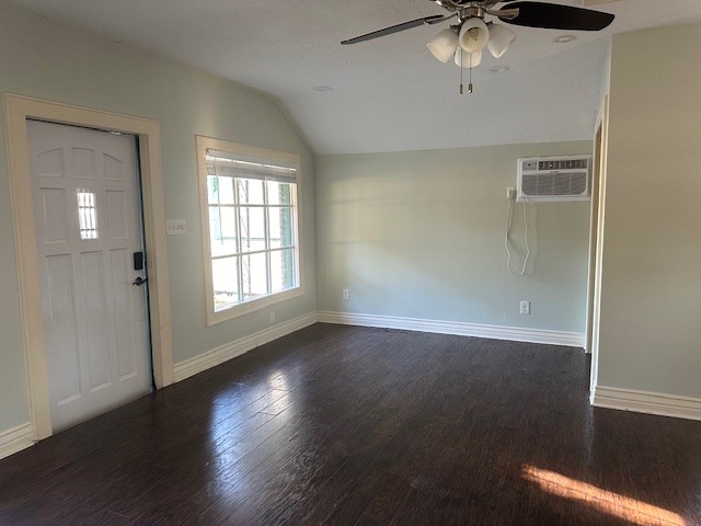 312b Prospect Drive Trinity, TX 75862 - Photo 22 of 23 an empty room with wooden floor chandelier fan and windows