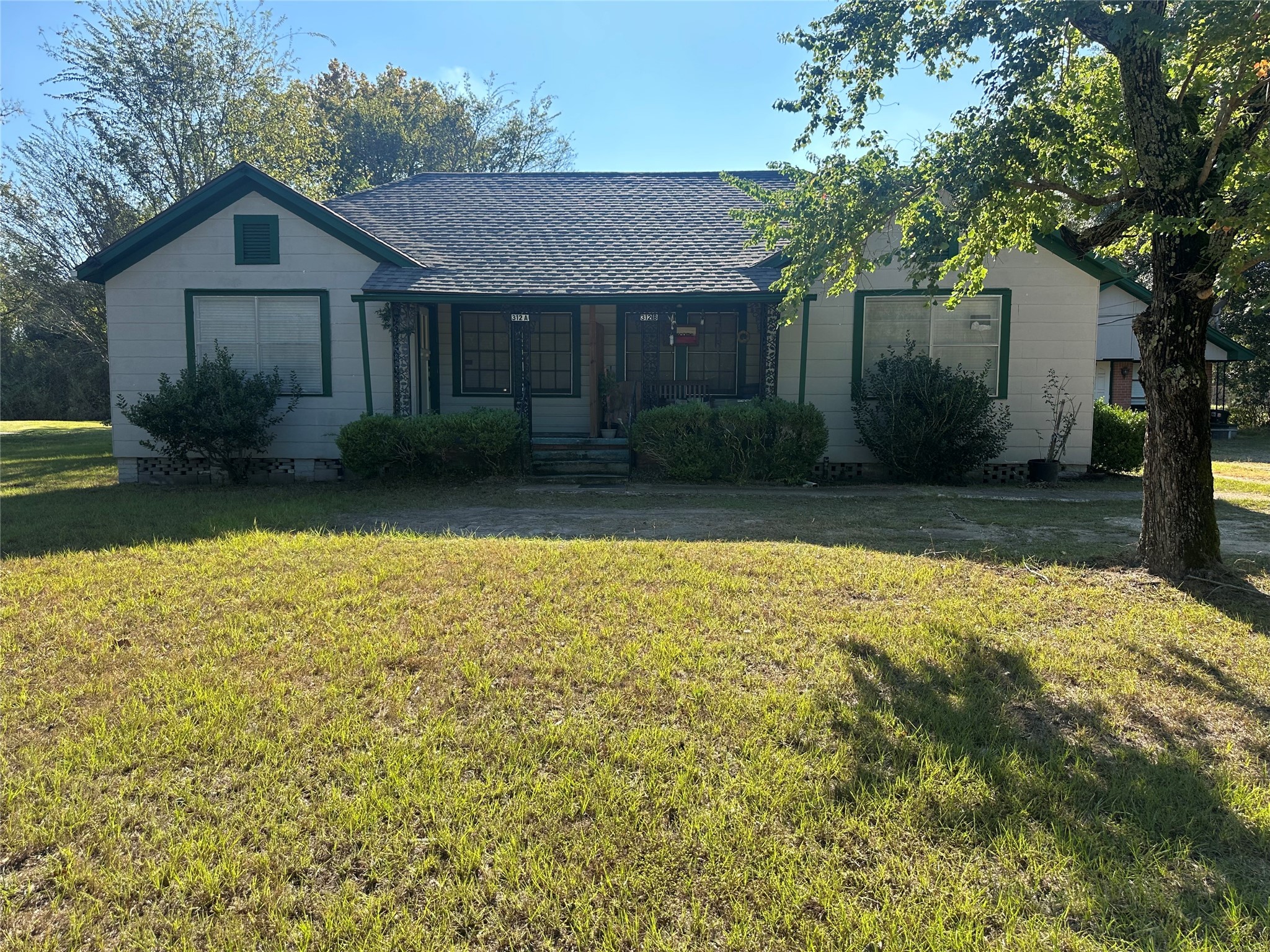 312b Prospect Drive Trinity, TX 75862 - Photo 6 of 23 a front view of a house with garden