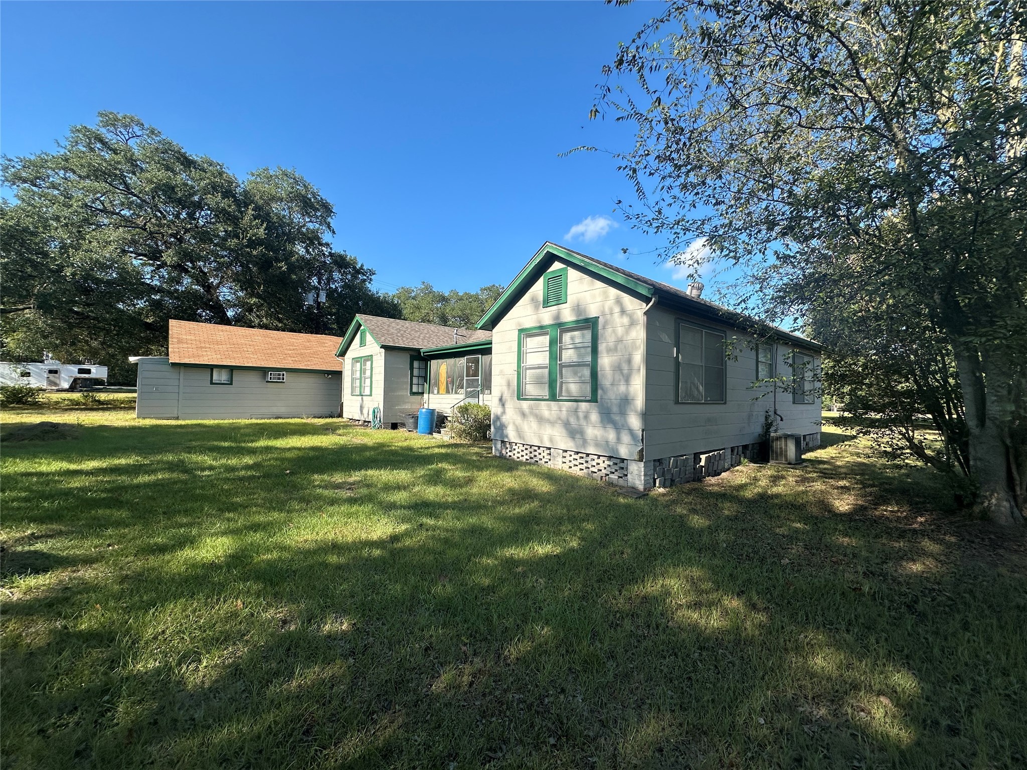 312b Prospect Drive Trinity, TX 75862 - Photo 10 of 23 a view of a house with a big yard and large tree