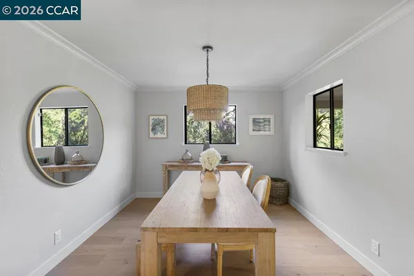 a dining room with window and outdoor view