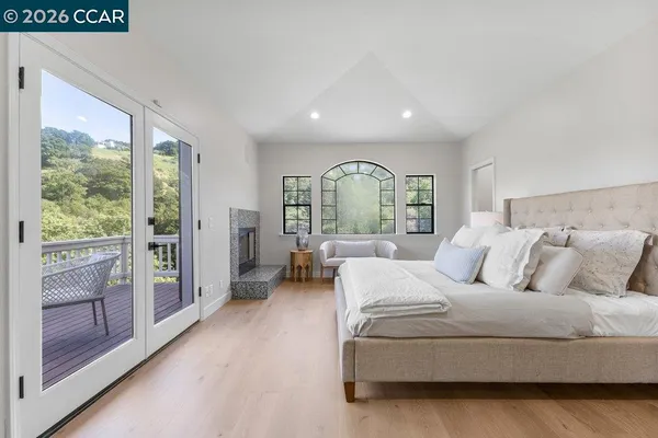 a bedroom with a large bed and a couch