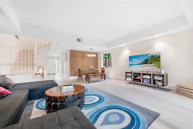 a living room with furniture and a table