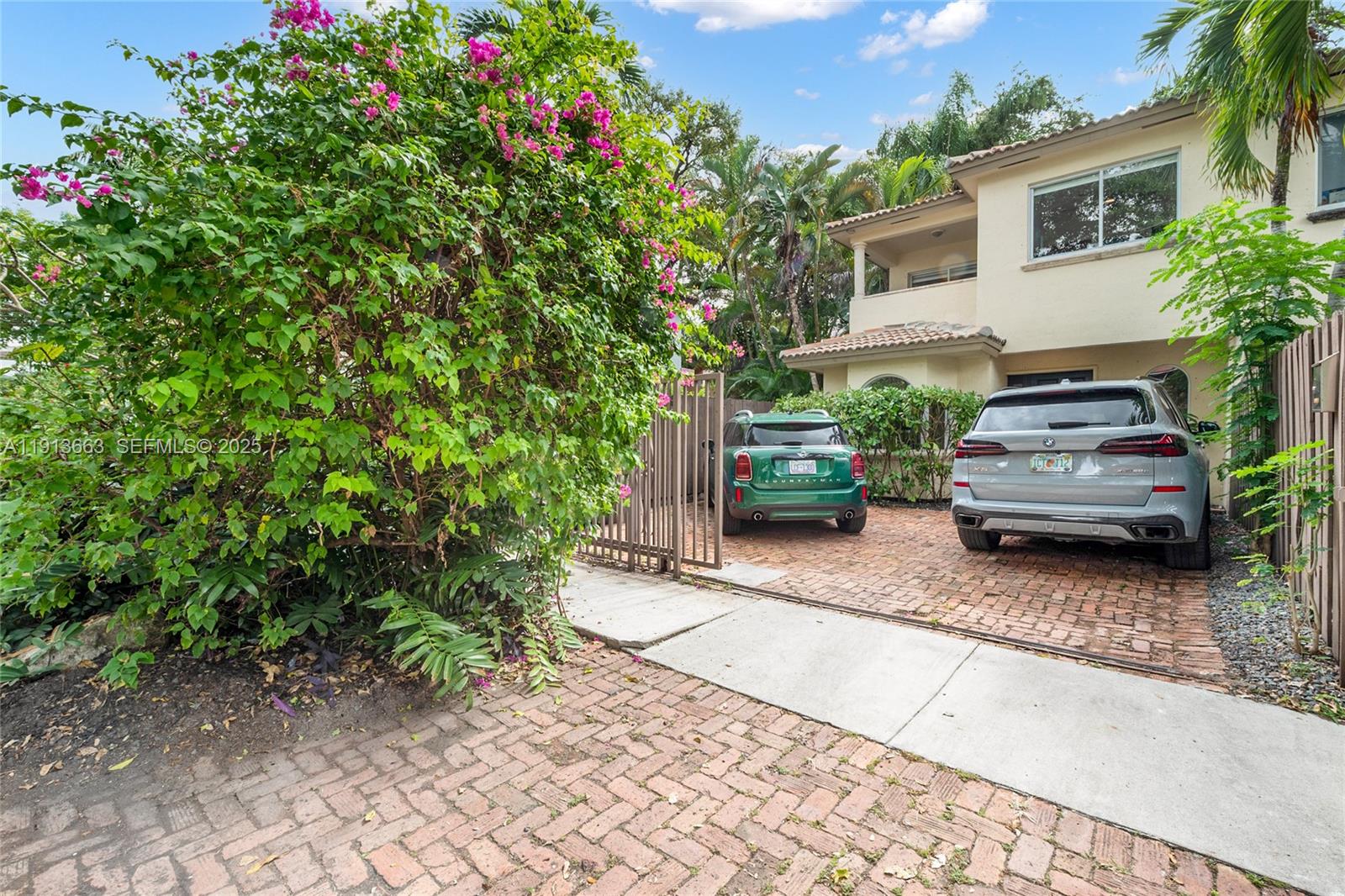 3124 Jackson Avenue, Unit 1 Miami, FL 33133 - Photo 2 of 23 a car parked in front of a house