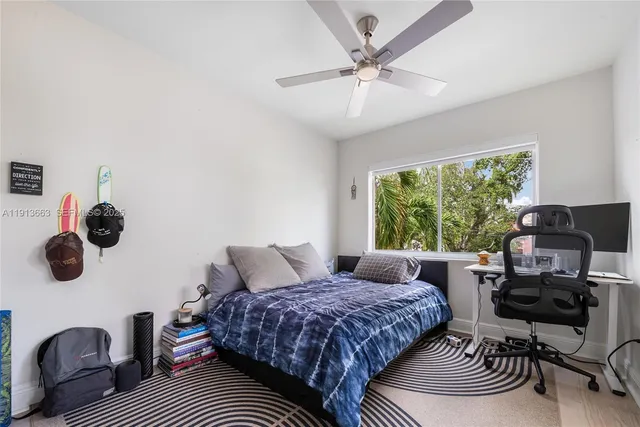 a bedroom with a bed furniture and a window