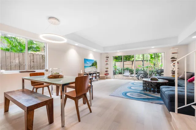 a view of a livingroom with furniture and window