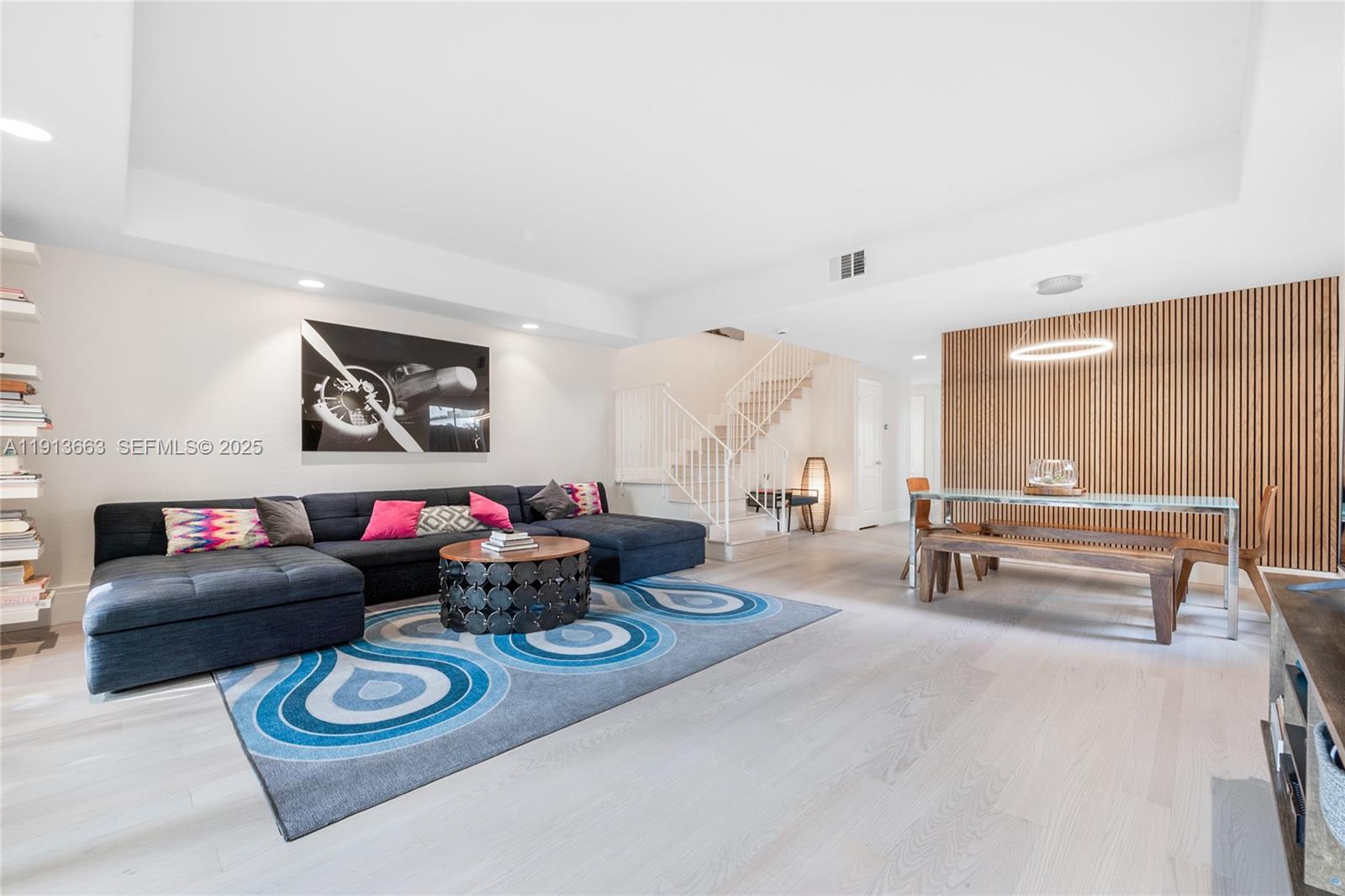 3124 Jackson Avenue, Unit 1 Miami, FL 33133 - Photo 4 of 23 a living room with furniture and a wooden floor