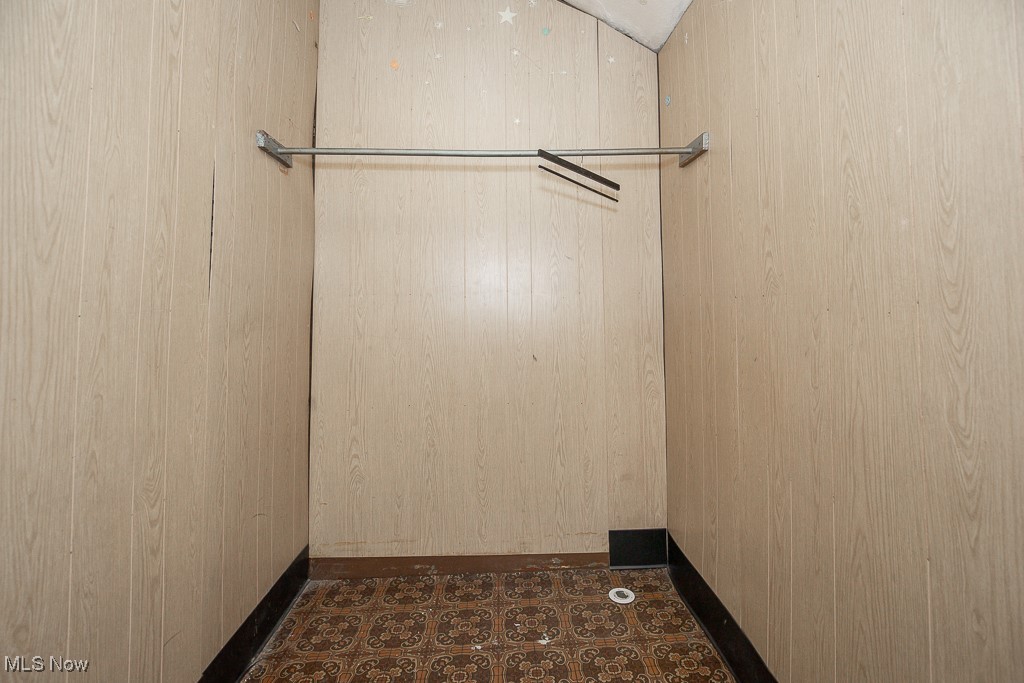 5008 Dolloff Road Cleveland, OH 44127 - Photo 14 of 16 Spacious closet featuring tile patterned floors