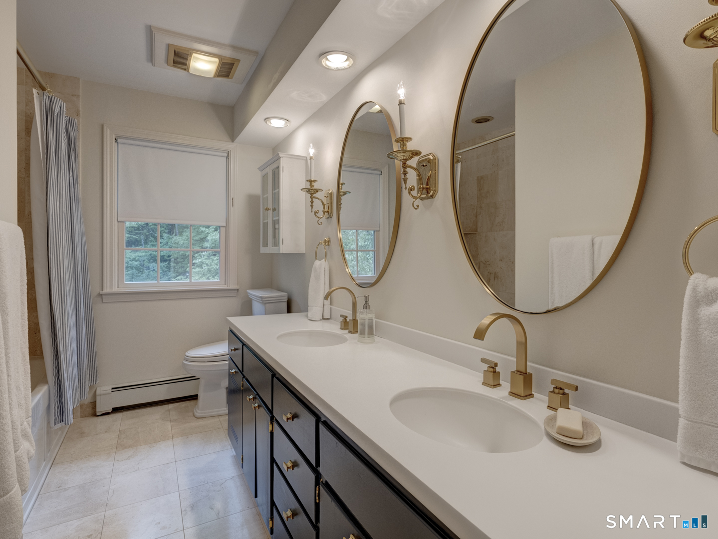 78 Windtree Street Torrington, CT 06790 - Photo 37 of 40 a bathroom with a double vanity sink and a mirror