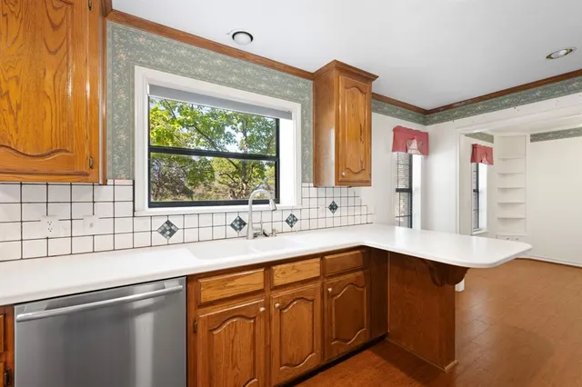 a kitchen with a sink and a window