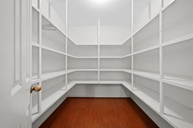 a view of a room with shelves on the wall