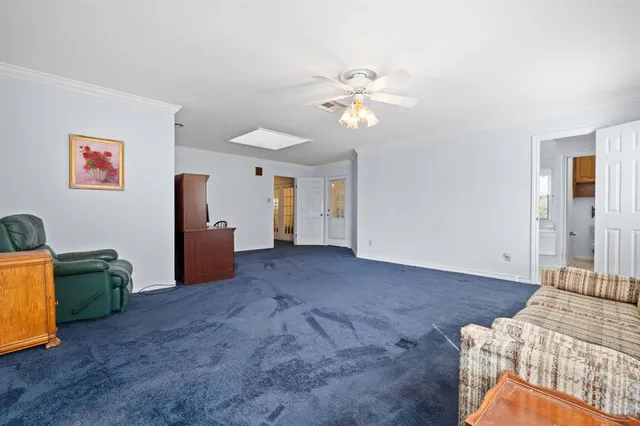 a view of a livingroom with furniture and chandelier