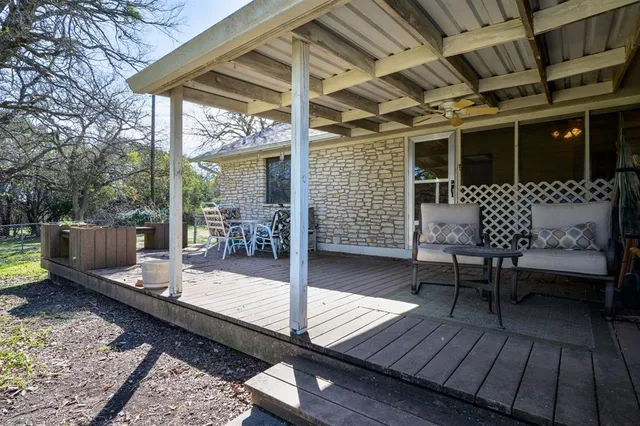 a view of a deck with wooden floor and roof
